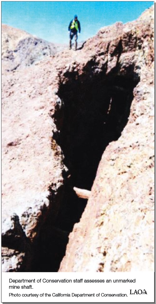 Department of Conservation staff assesses an unmarked mine shaft.